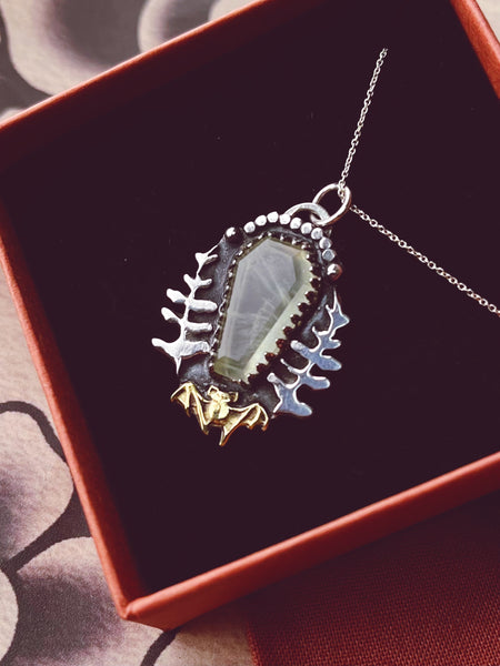 Bat fern pendant necklace.