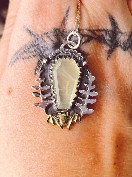Bat fern pendant necklace.
